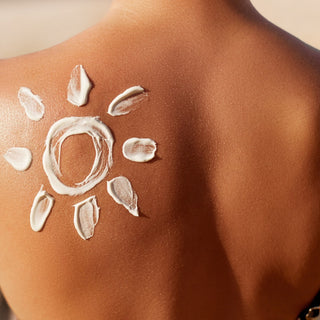 How does sunblock work to protect the skin?